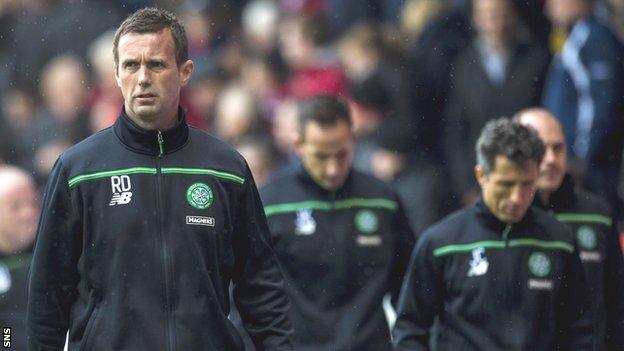 Celtic manager Ronny Deila, coach John Kennedy and assistant boss John Collins cut disconsolate figures at the end of the defeat at Pittodrie