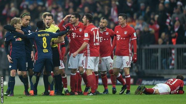 Emil Forsberg is led away by team-mates shortly before being shown the red card