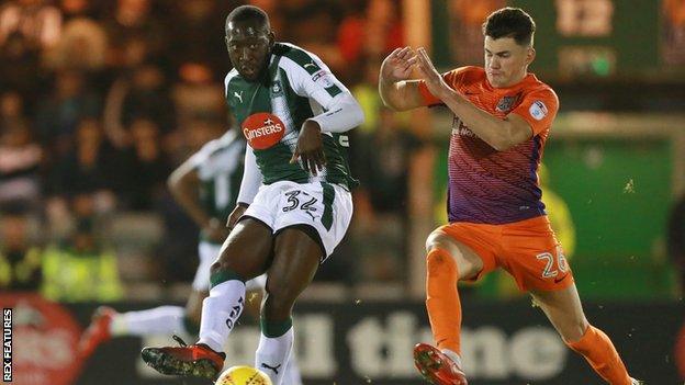 Regan Poole (R) spent last season on loan at Northampton after joining Manchester United from Newport