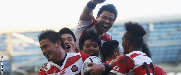 Japan celebrating victory over South Africa