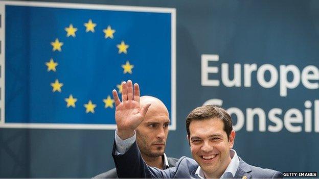 Alexis Tsipras, Greece's prime minister, waves as he departs a EU summit meeting in Brussels, Belgium