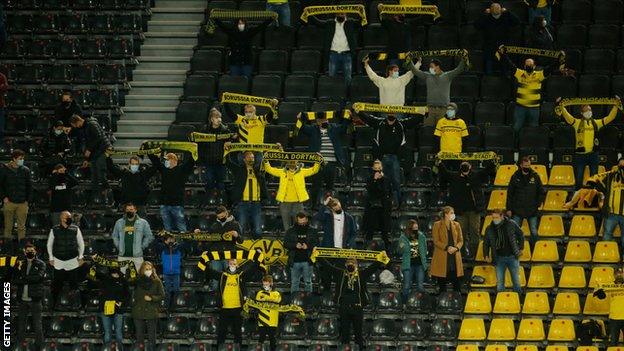 Borussia Dortmund fans support their side during a game against Schalke