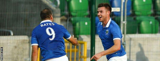 Guy Bates congratulates Linfield goalscorer Stephen Lowry