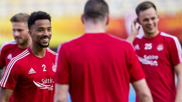 Aberdeen's Shay Logan shares a joke during training