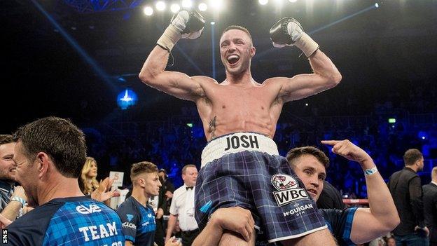 Josh Taylor is held aloft by trainer Shane McGuigan