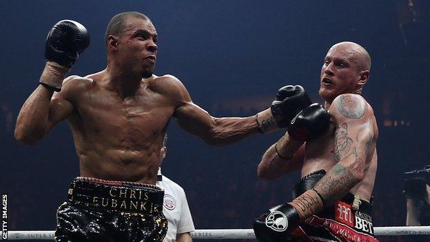 Chris Rubank Jr takes a left handed swing at George Groves