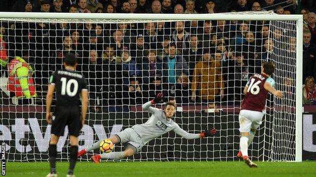 Mark Noble coolly slots his 50th goal for West Ham during the first half at London stadium