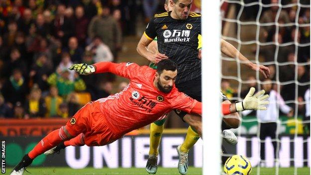 Rui Patricio of Wolves makes a save against Norwich