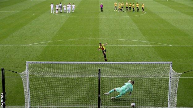 Harrogate Town captain Josh Falkingham scores the winning penalty against Tranmere Rovers