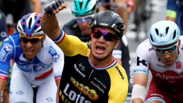 Dylan Groenewegen celebrates winning the final stage of the race