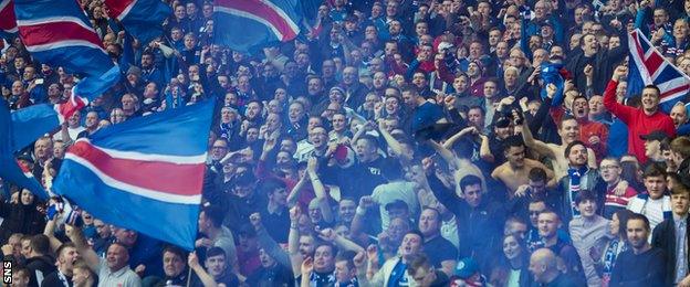 Rangers fans celebrate during their Scottish Cup semi-final against Celtic