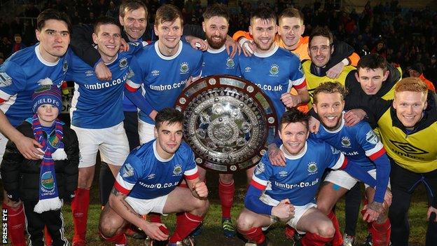 Linfield celebrate their Co Antrim Shield success at the Ballymena Showgrounds in February