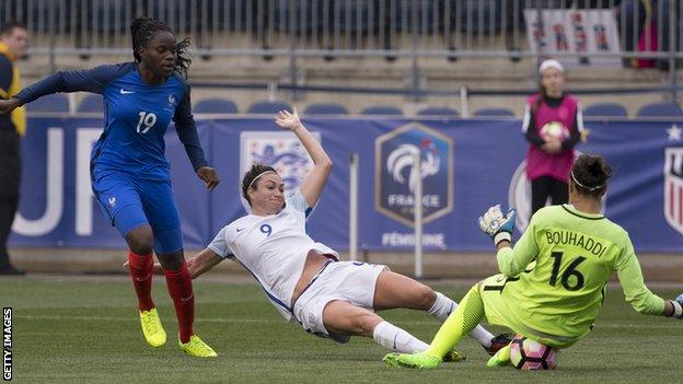 Jodie Taylor (centre) is denied a goal