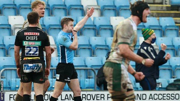 Referee Christophe Ridley ends the game after Joe Simmonds' kick is charged down