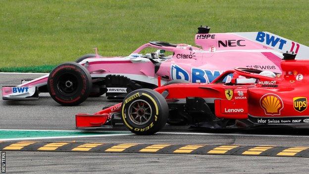 Sebastian Vettel passes Sergio Perez