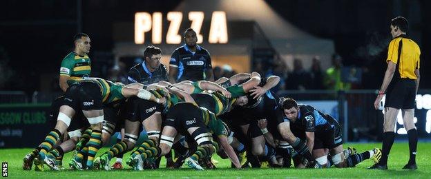 Glasgow Warriors and Northampton Saints pack down for a scrum at Scotstoun