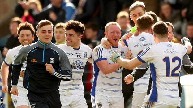 Cavan players celebrate after earning promotion