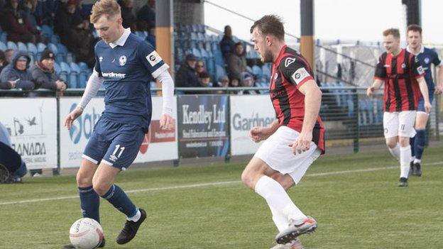 Airbus UK Broughton's George Peers (left) in action against Llanidloes