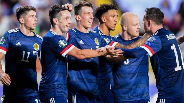 Scotland players celebrate John McGinn's (second left) goal