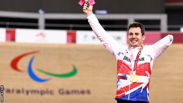 Jaco van Gass celebrates on the podium after receiving his gold medal