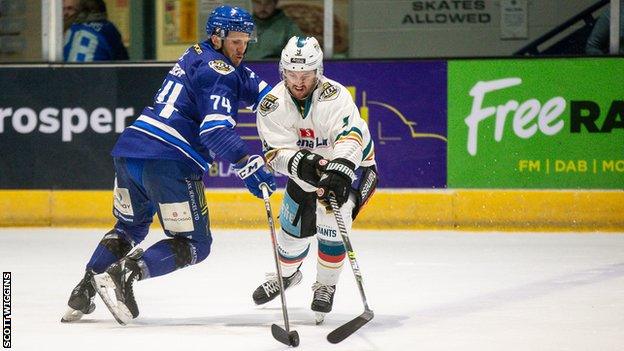 Coventry's Nathanael Halbert and Giants opponent Ben Lake battle for possession in the first leg