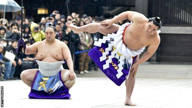 Sumo wrestlers perform a ritual