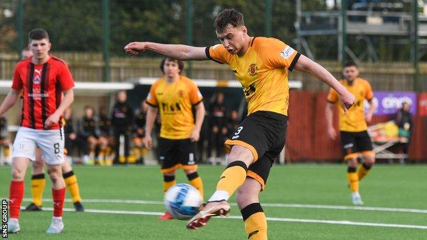 Annan's Max Kilsby scores to make it 1-0 during a cinch League One play-off final first leg match between Annan Athletic and Clyde at Galabank