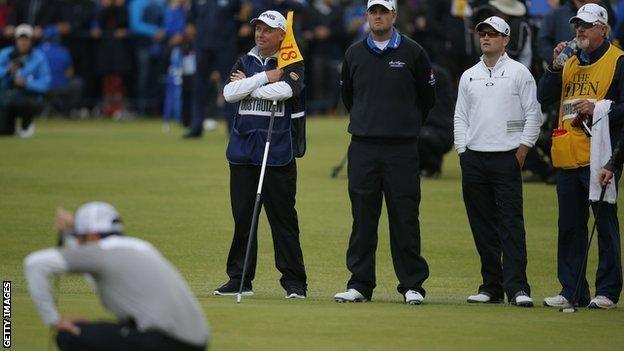 Miguel Angel Jimenez and Retief Goosen search for a ball at the Open Championship, 2009