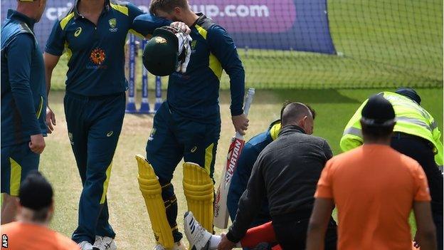 David Warner looks away as Jaykishan Plaha receives treatment
