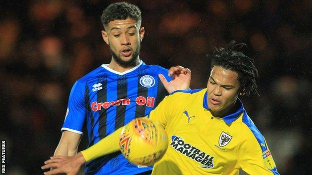 Rekeil Pyke and Toby Sibbick battle for the ball