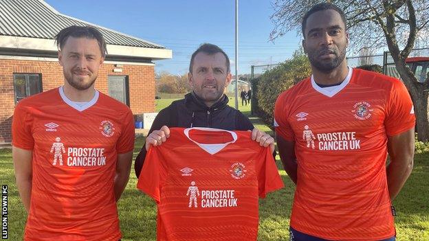 Harry Cornick, Nathan Jones and Cameron Jerome (left to right) model Luton's shirt