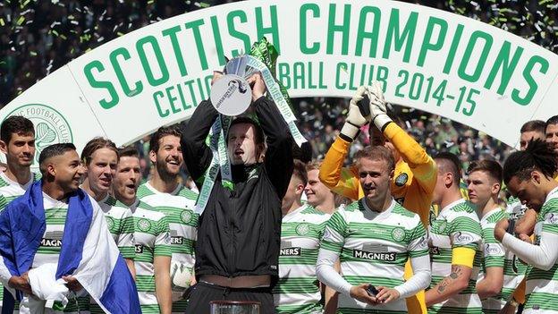 Celtic players and management celebrating with the Scottish Premiership trophy