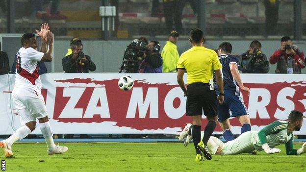 Peru striker Jefferson Farfan earns a penalty against Scotland