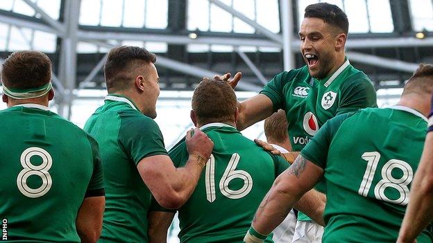 Ireland celebrate after scoring the fourth try which secured a bonus point against Scotland