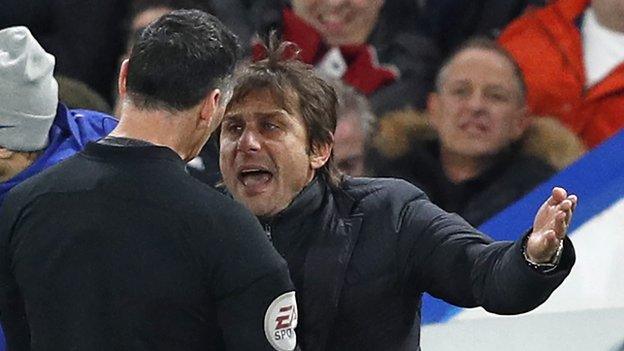 Antonio Conte argues with referee Neil Swarbrick before being sent from the touchline