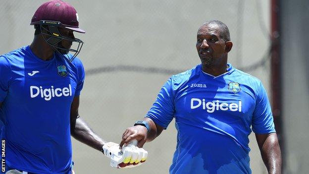 Phil Simmons (right) with Jason Holder