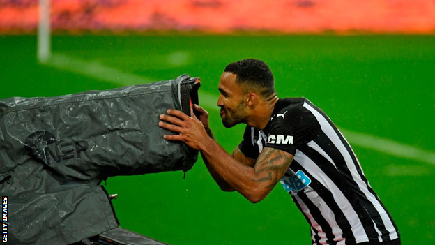 Callum Wilson goes to kiss a TV camera