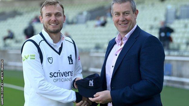 Danny Briggs received his Warwickshire county cap from another Bears and England left-arm spinner, Ashley Giles