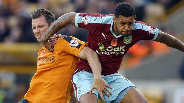 Mike Williamson challenges Andre Gray