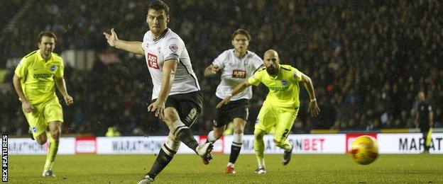 Chris Martin scores from the penalty spot