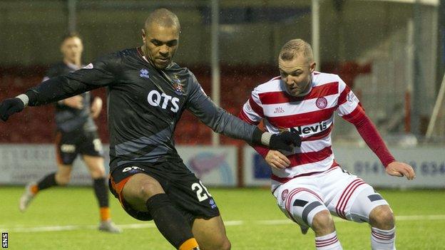 Josh Magennis takes on Hamilton's Grant Gillespie