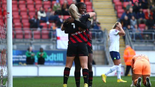 Lauren Hemp of Man City celebrates after scoring the teams third goal with fellow goal scorer Khadija Shaw