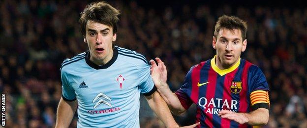 Jon Aurtenetxe in action for Celta Vigo against Barcelona's Lionel Messi