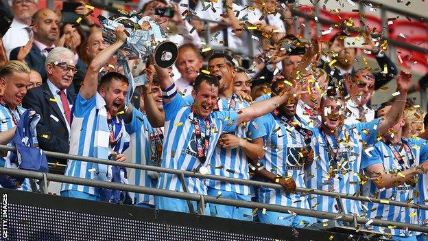 Coventry captain Michael Doyle with the League Two play-off trophy