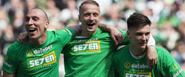 Scott Brown (left) and Keiran Tierney (right) celebrate after Celtic clinched their seventh consecutive title