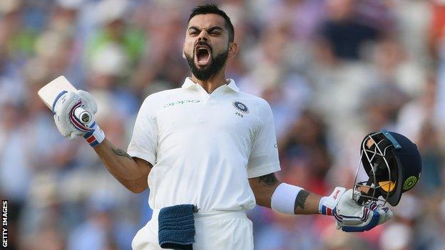 Virat Kohli celebrates scoring a century against England