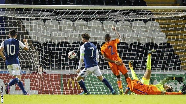 Oliver Burke slams in the opening goal for Scotland in Paisley