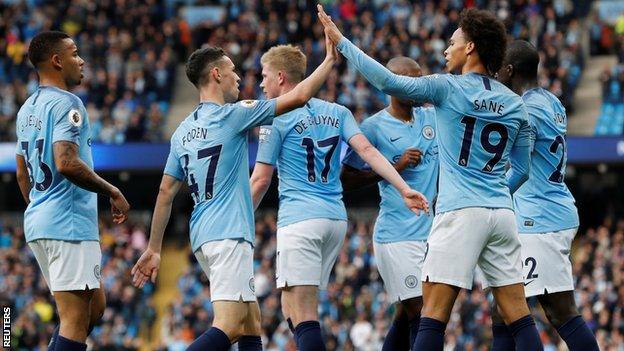 Manchester City players celebrate against Burnley