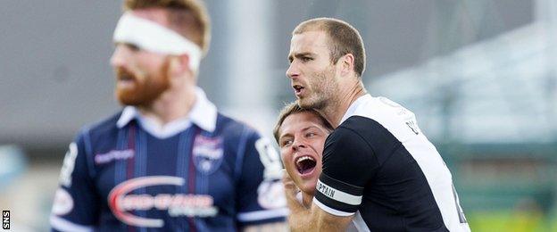 Dundee United midfielder John Rankin celebrates Sean Dillon's 30-yard goal