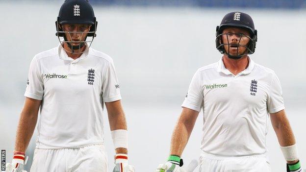 Joe Root and Ian Bell walk off